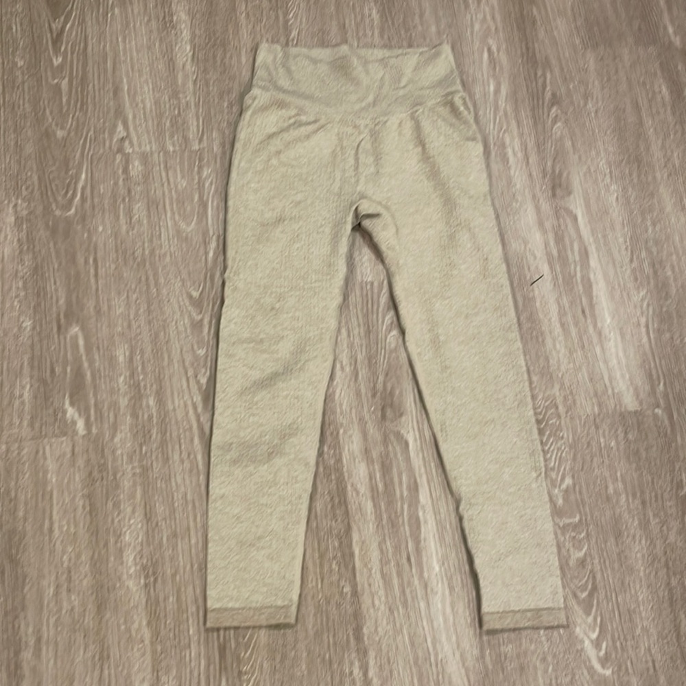 Cream flattering leggings. Tight and thin. Not see through at all.